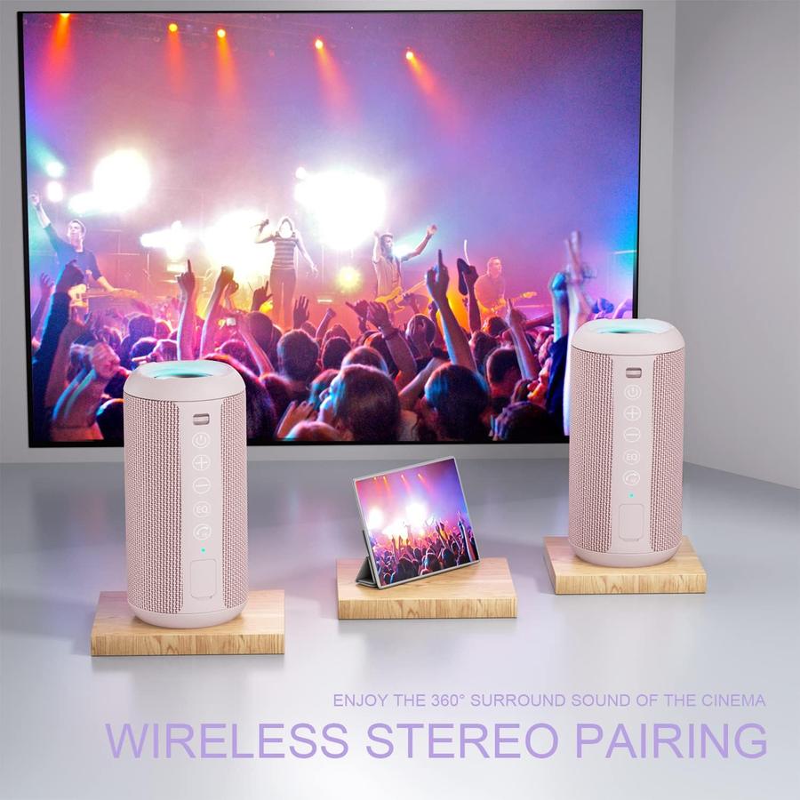 Two speakers paired for wireless stereo in front of a screen
